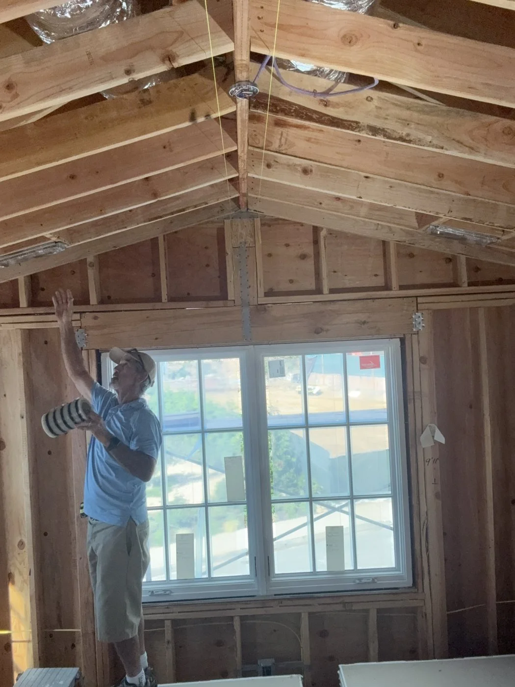 Duct openings masked off in vaulted framing for a rough-in test