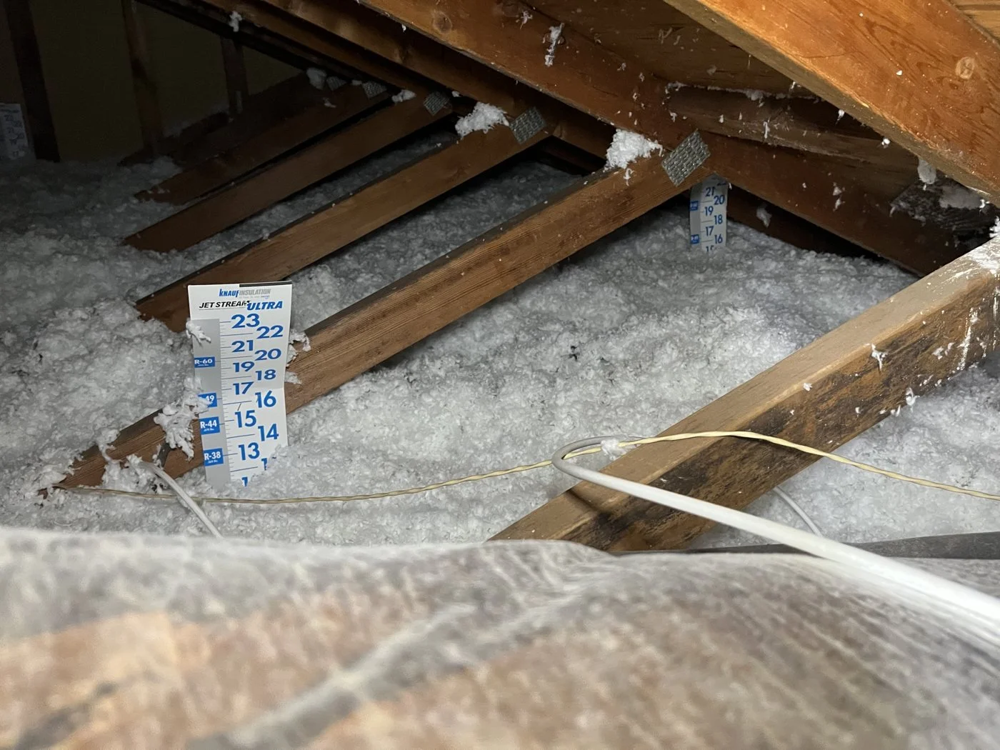 Buried ducts covered in blown insulation
