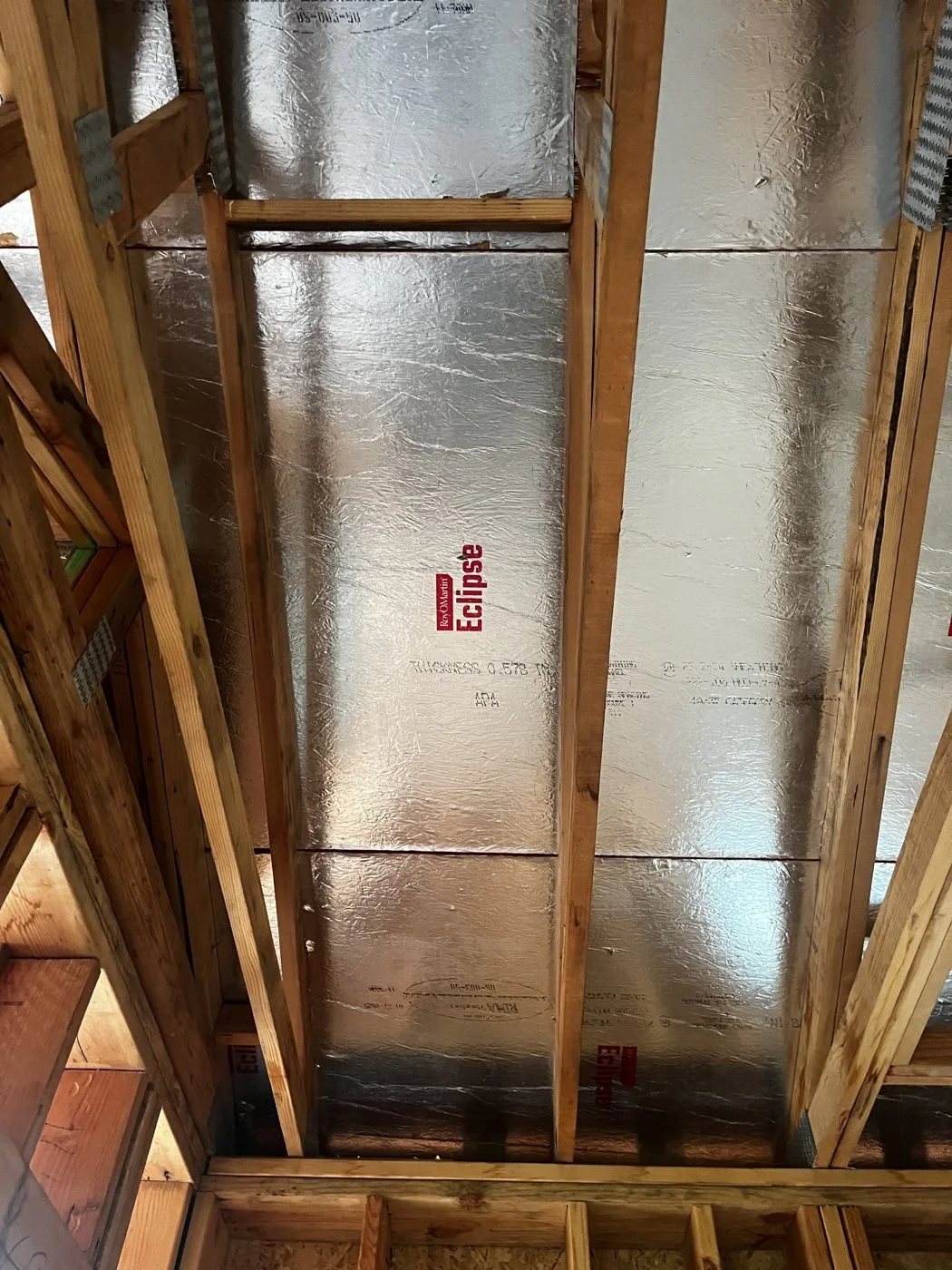 Radiant barrier sheathing at the roof deck
