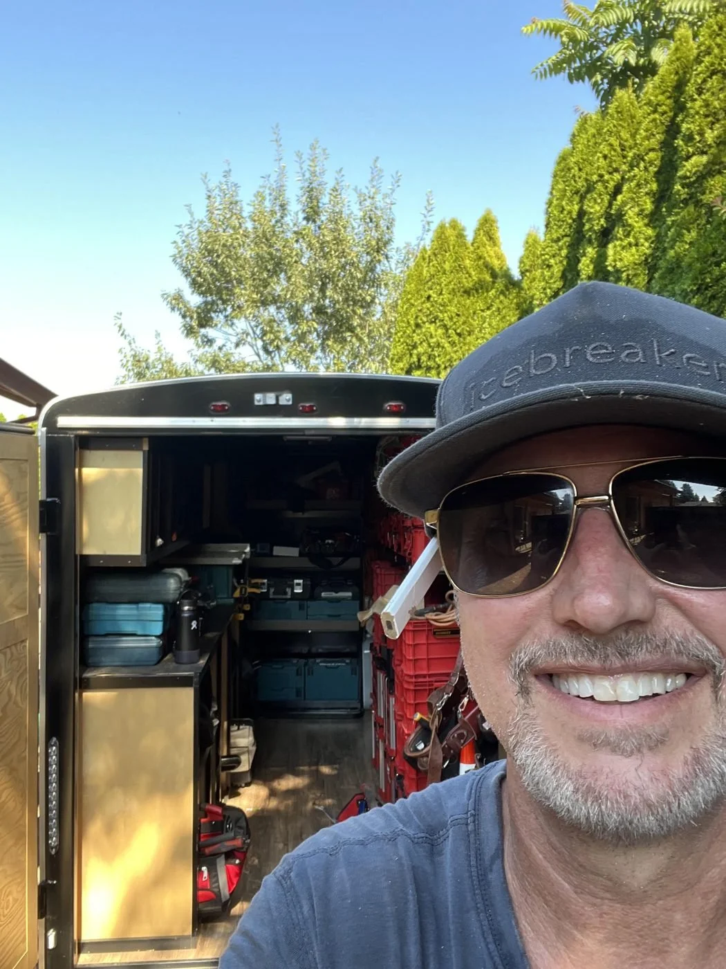 Joel Hope, founder of Ardent Remodel, in front of his tool trailer