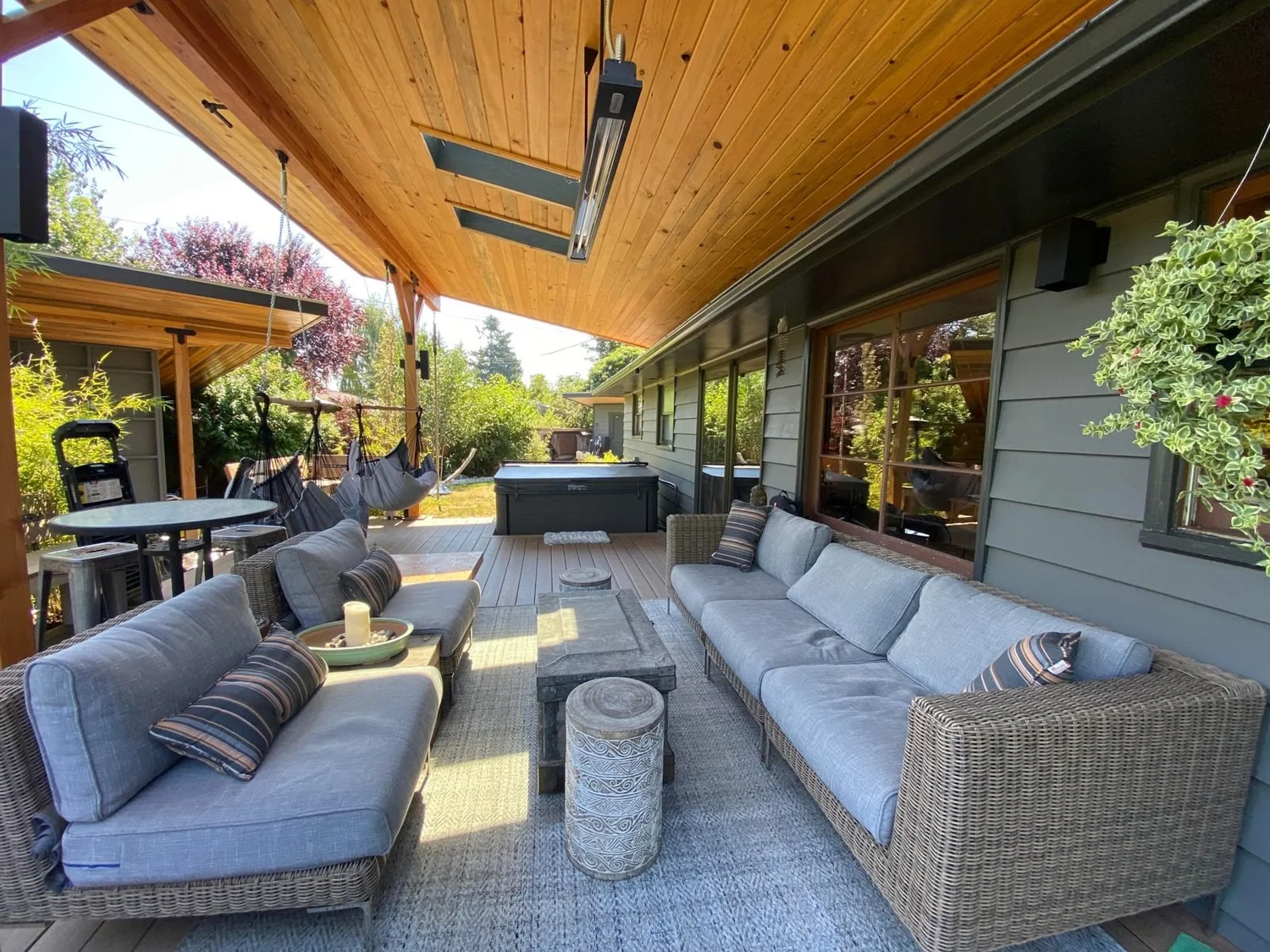 Covered patio with cedar ceiling, heaters and outdoor seating