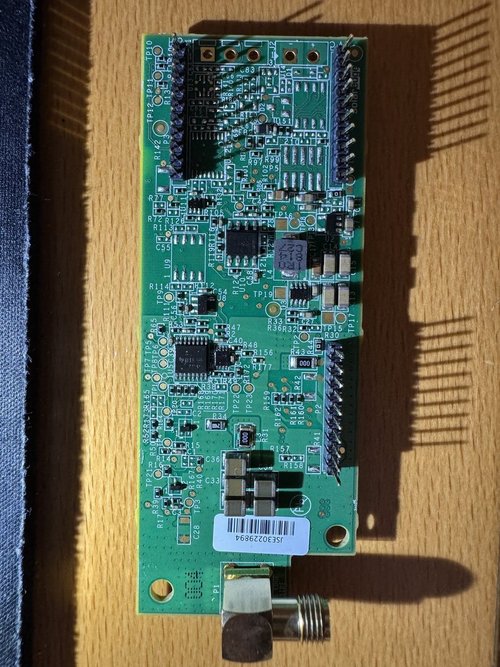 Underside of removed SolarEdge cellular board with pin headers and RF connector