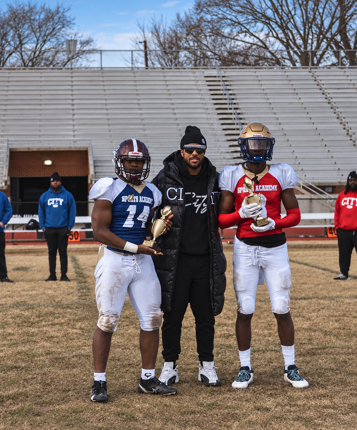 Tommy Reamon with trophy-winning players at the Peninsula All-Star Game in Hampton, Virginia.