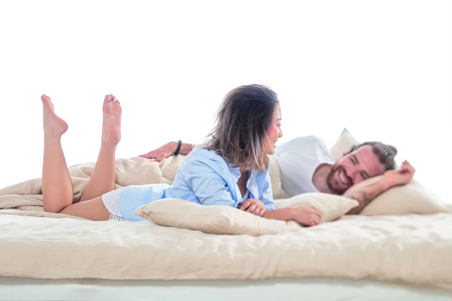 Couple relaxing on a natural latex mattress