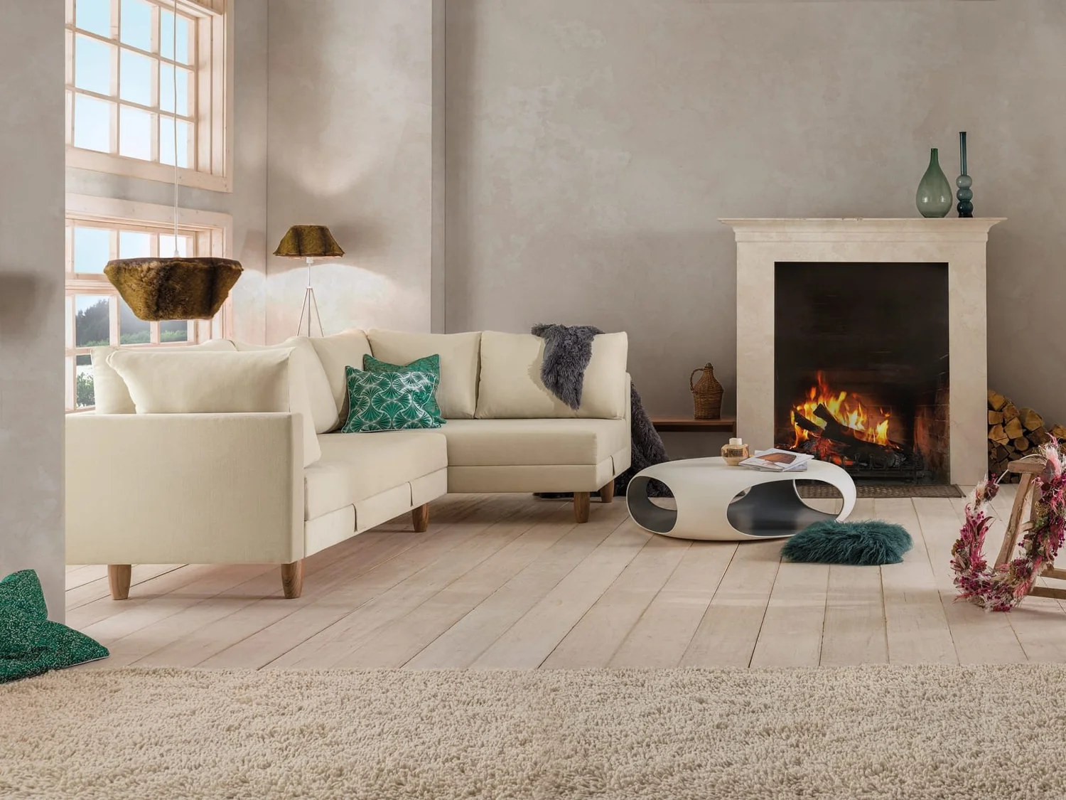 Zedulo 5 cream corner sofa bed beside a fireplace