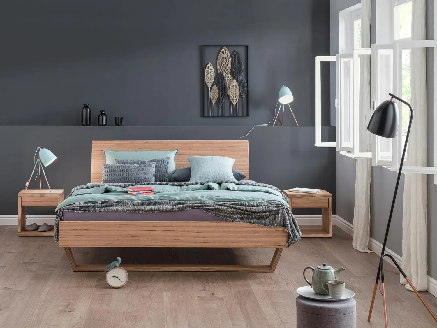 Dormiente Udana solid wood bed with sled-style feet