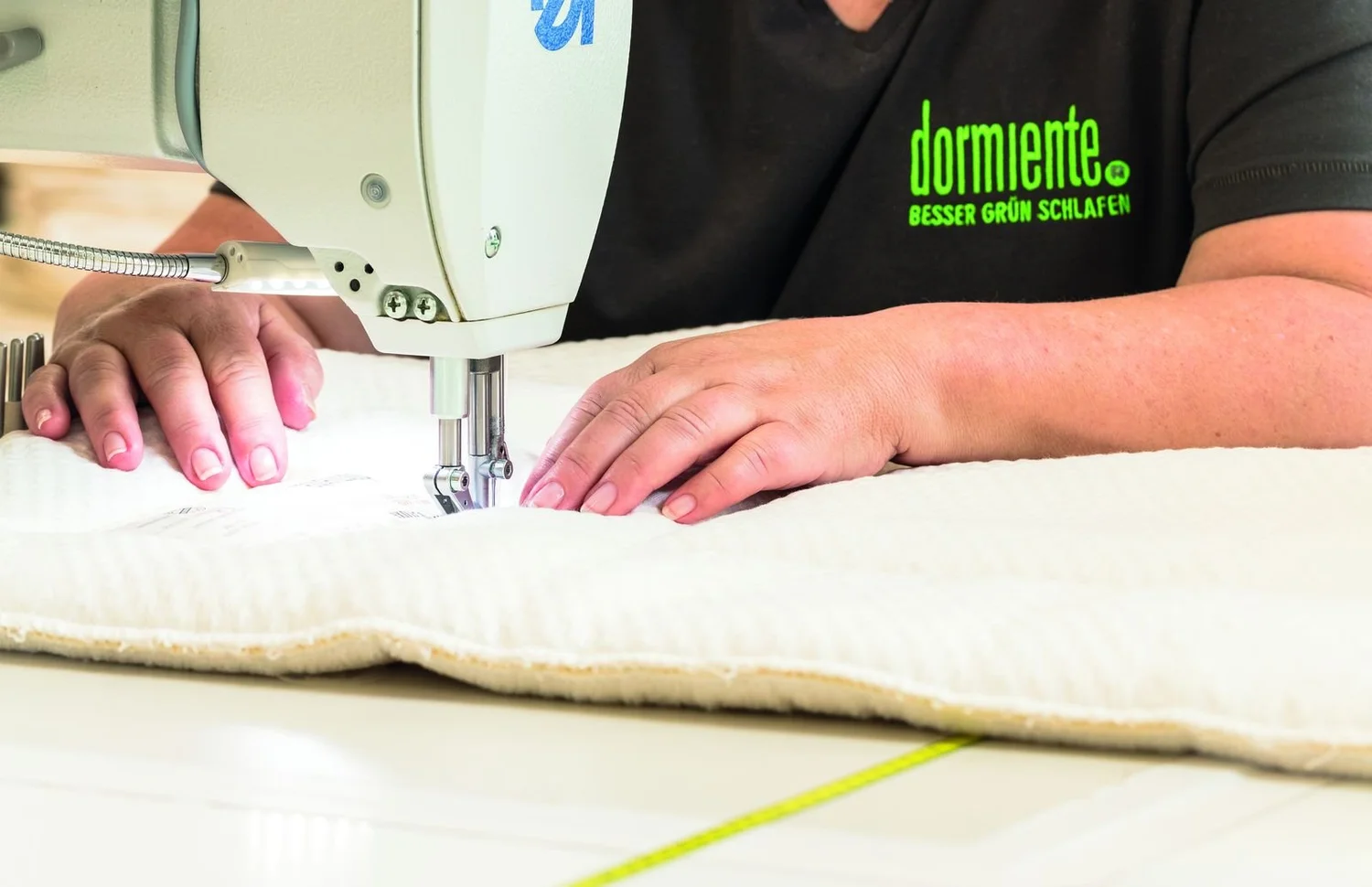 Mattress cover being sewn by hand in Germany