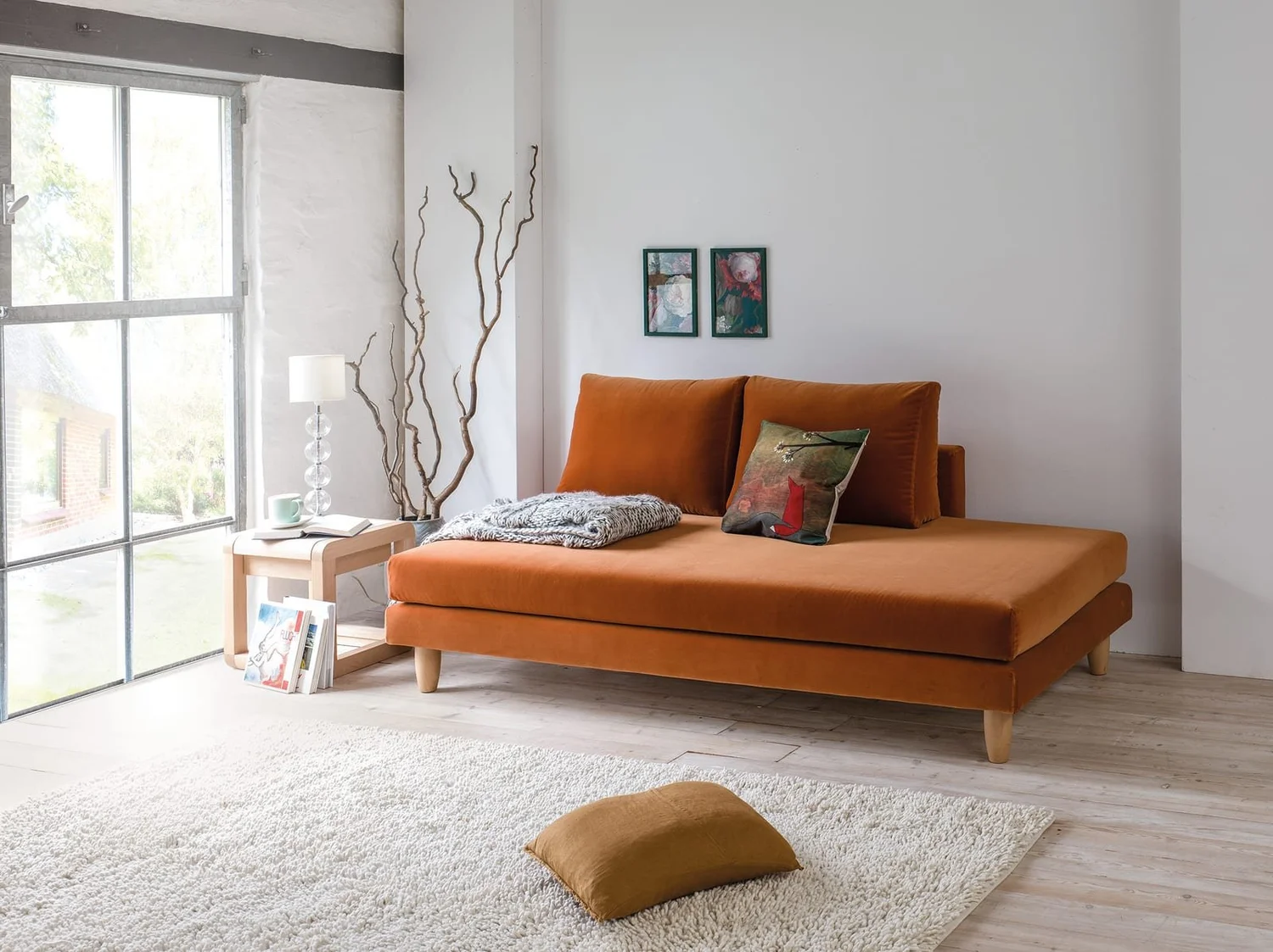 Dormiente Lounge S sofa bed in rust velvet, set as a sofa