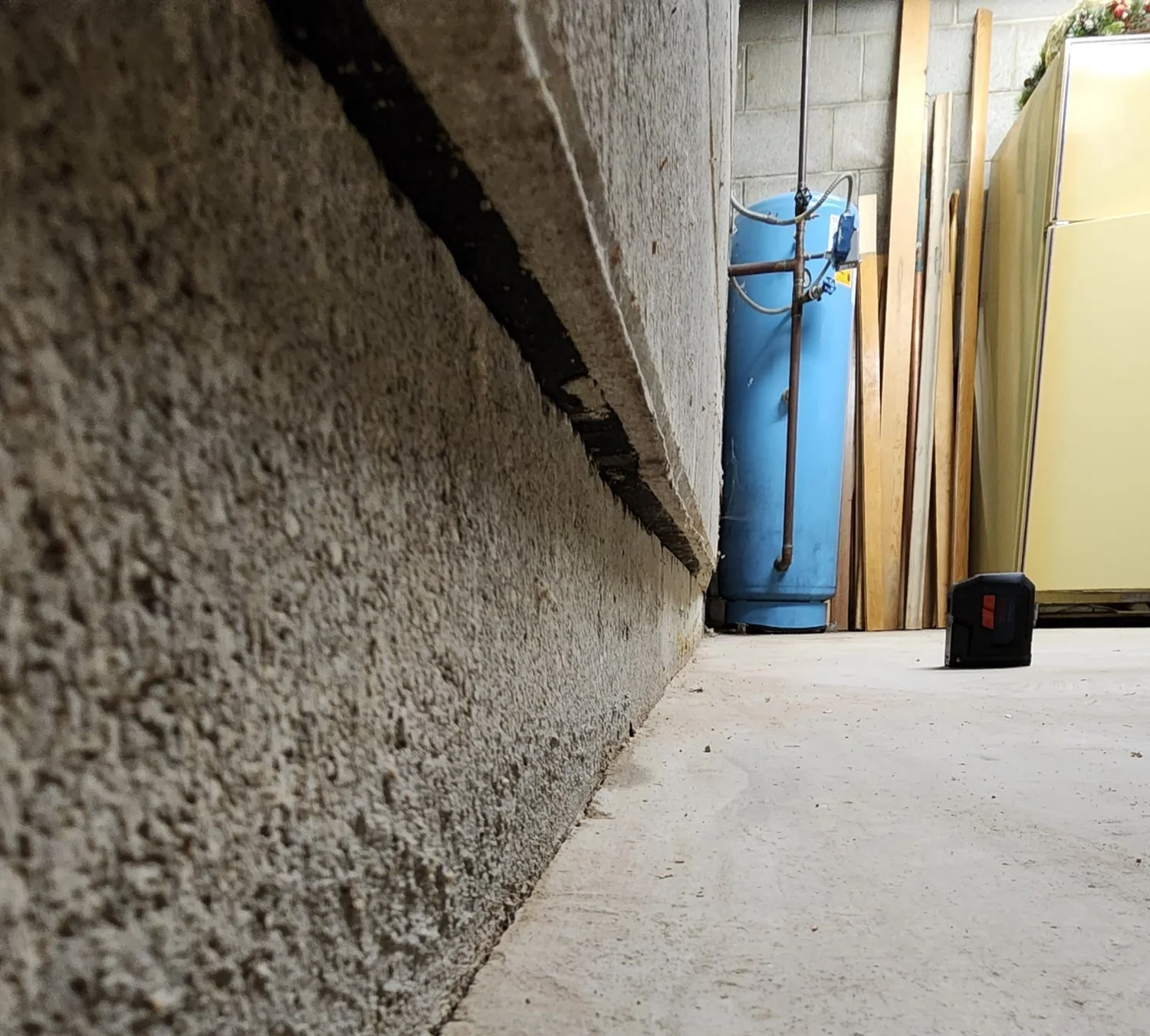 About 1 1/2 in. of slide at the 2nd course. The bottom block is held by the slab; everything above has moved in.
