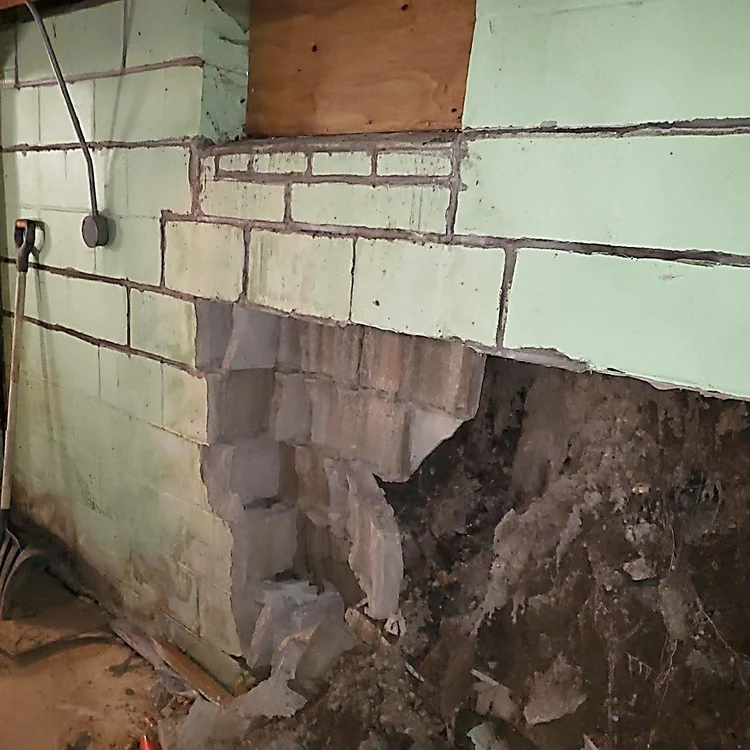 A block foundation wall displaced inward