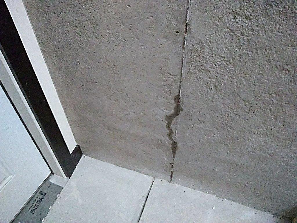 Crack with heavy staining and mineral deposit, a long-term water path.