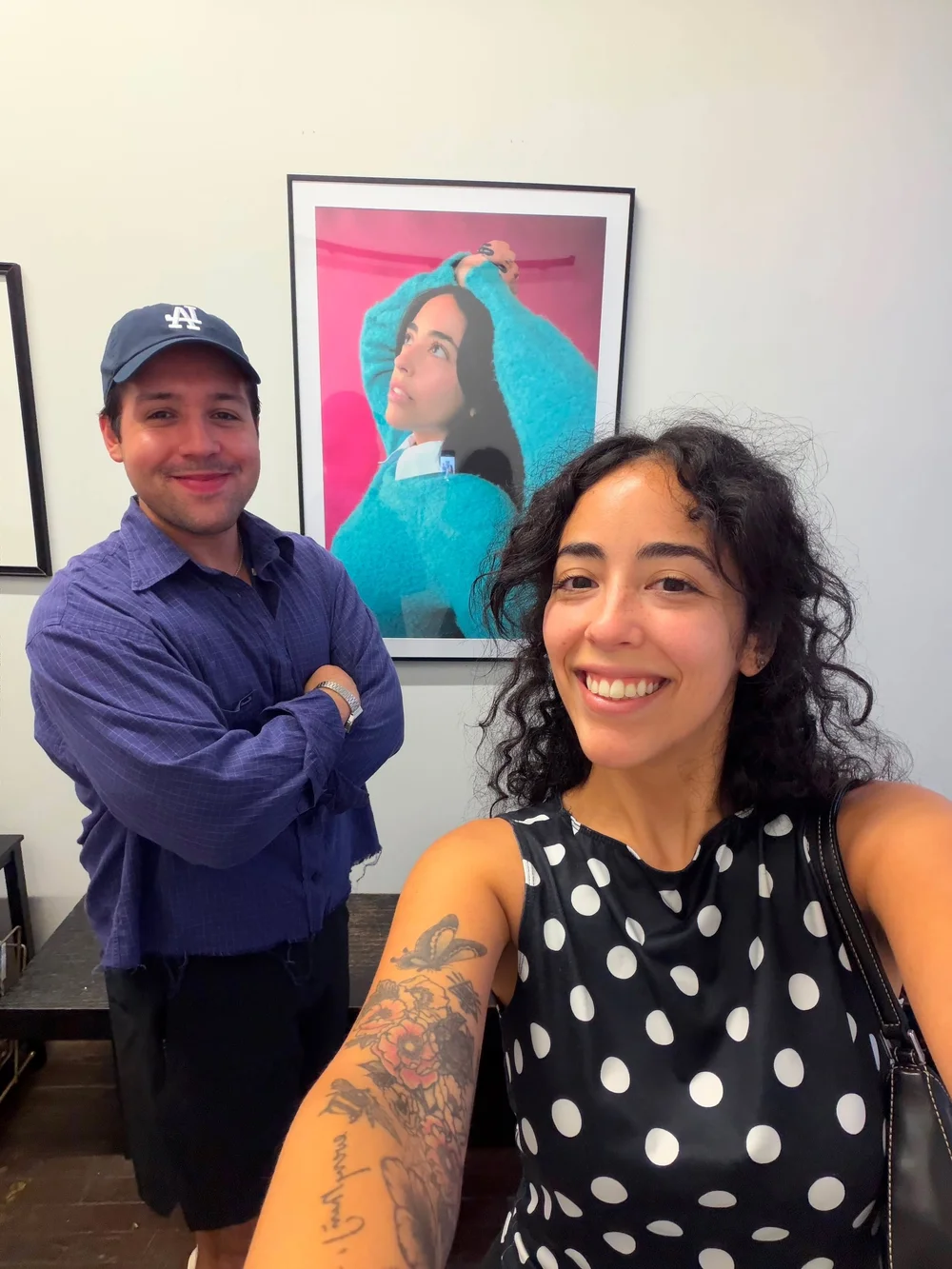 Alejandro Deleon and Paola Miano beside the winning print