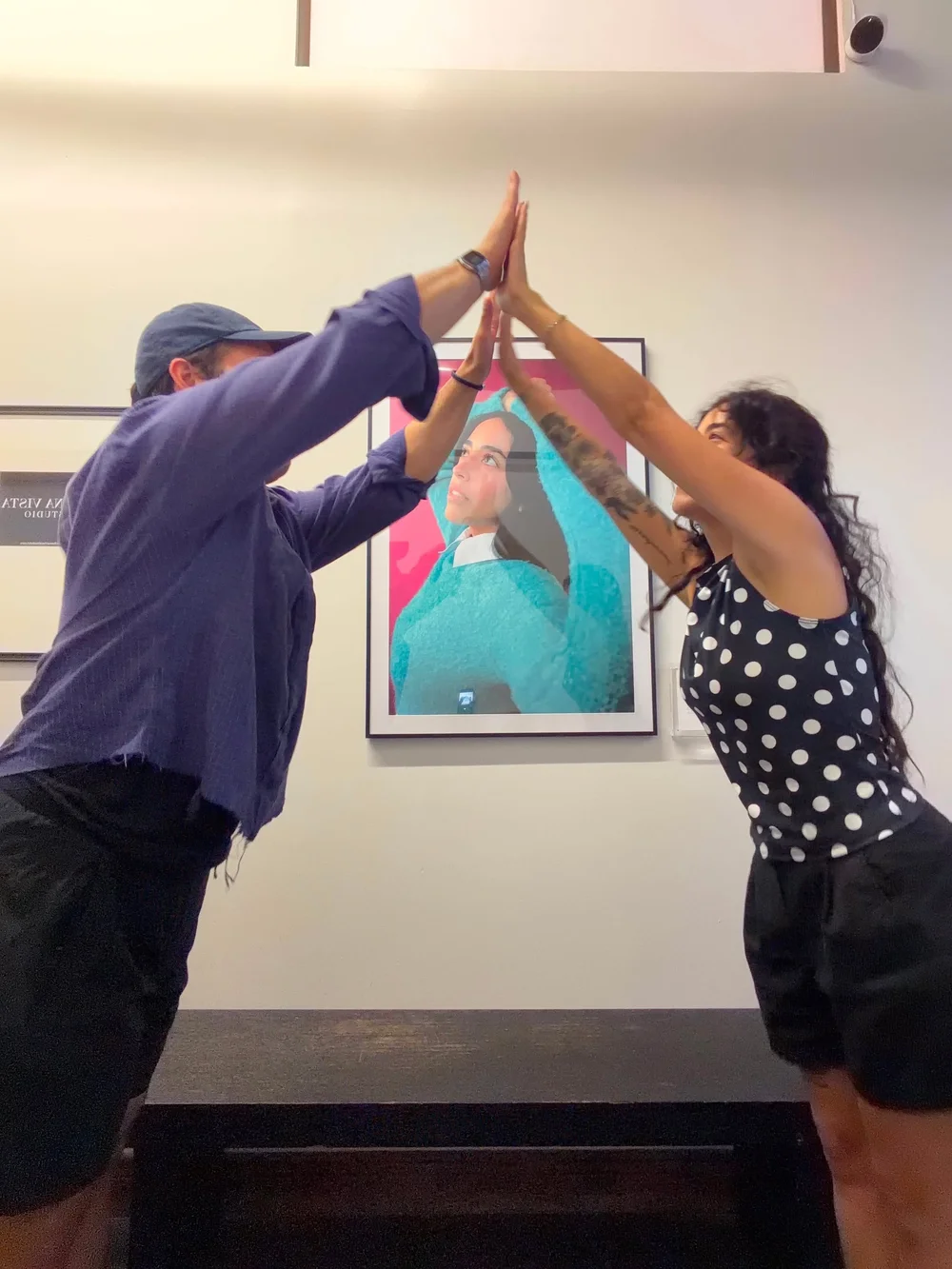 Alejandro Deleon and Paola Miano celebrating the print reveal