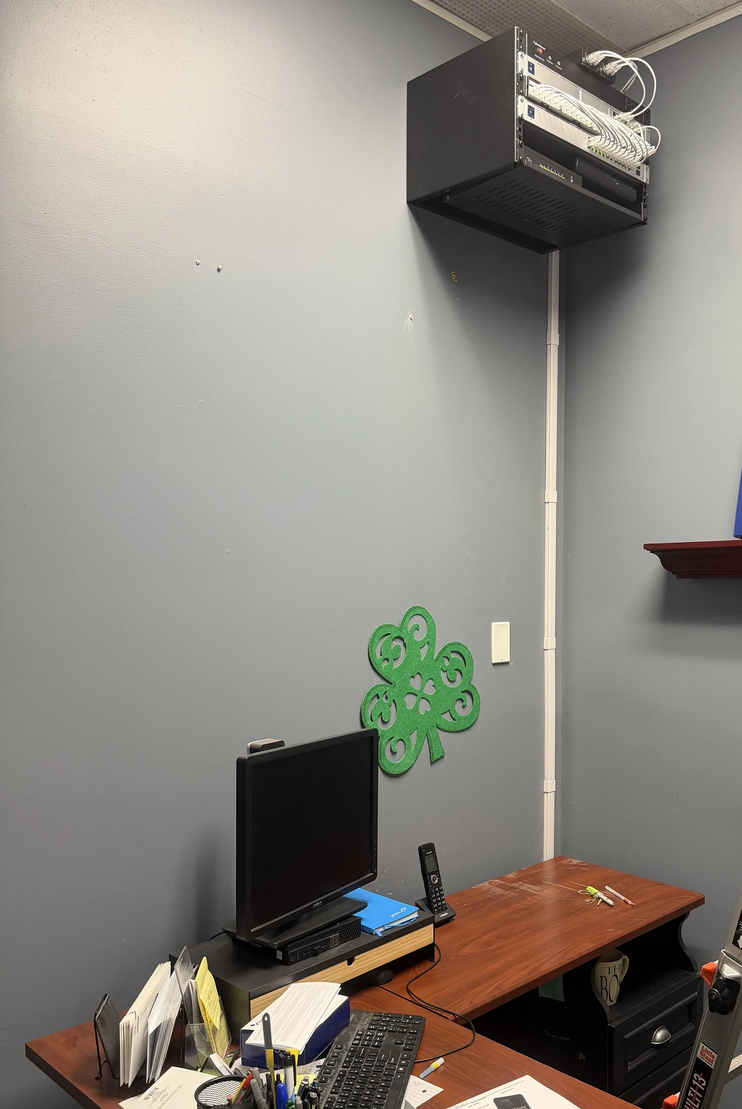 Wall-mounted network rack and office workstation