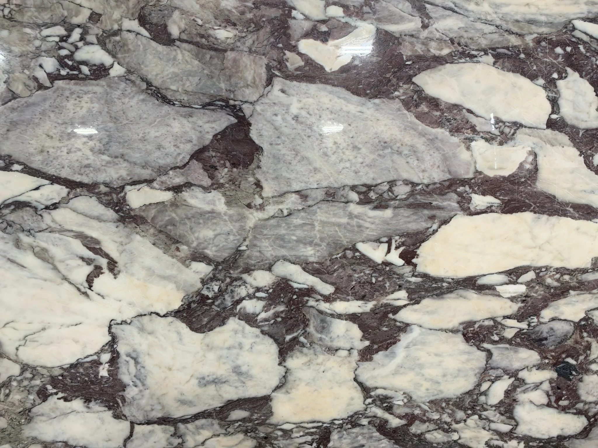 Burgundy mineral mosaic stone slab detail