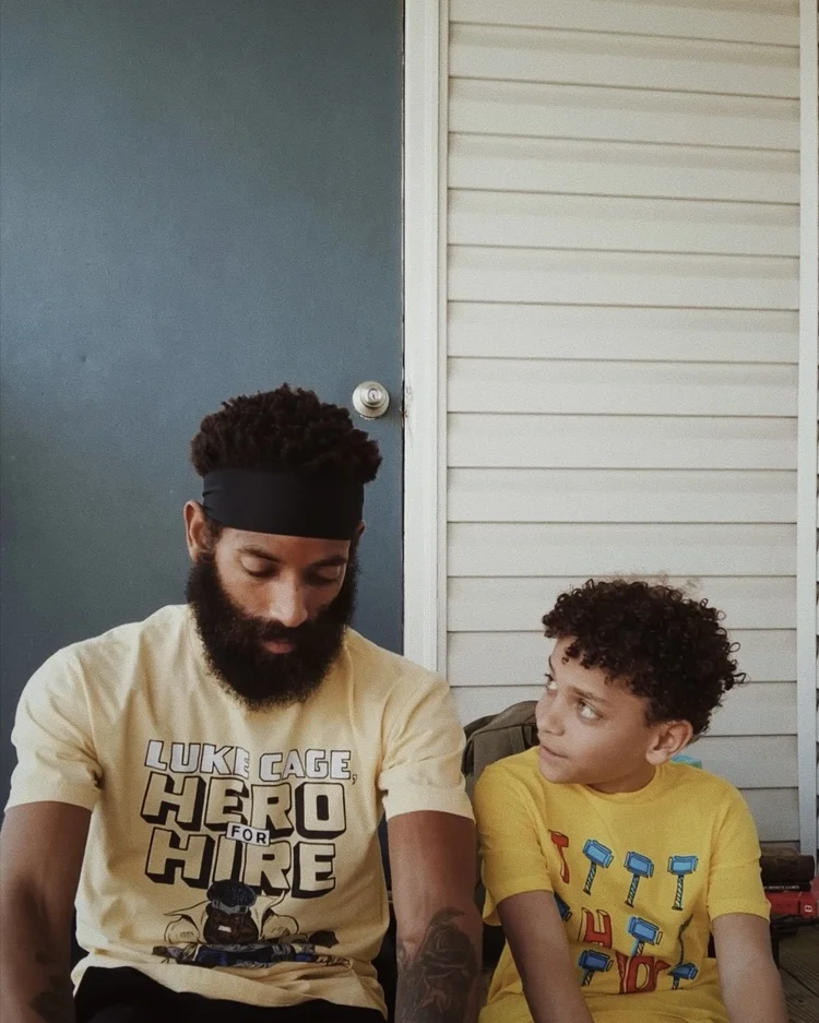 A father and son talking on the porch