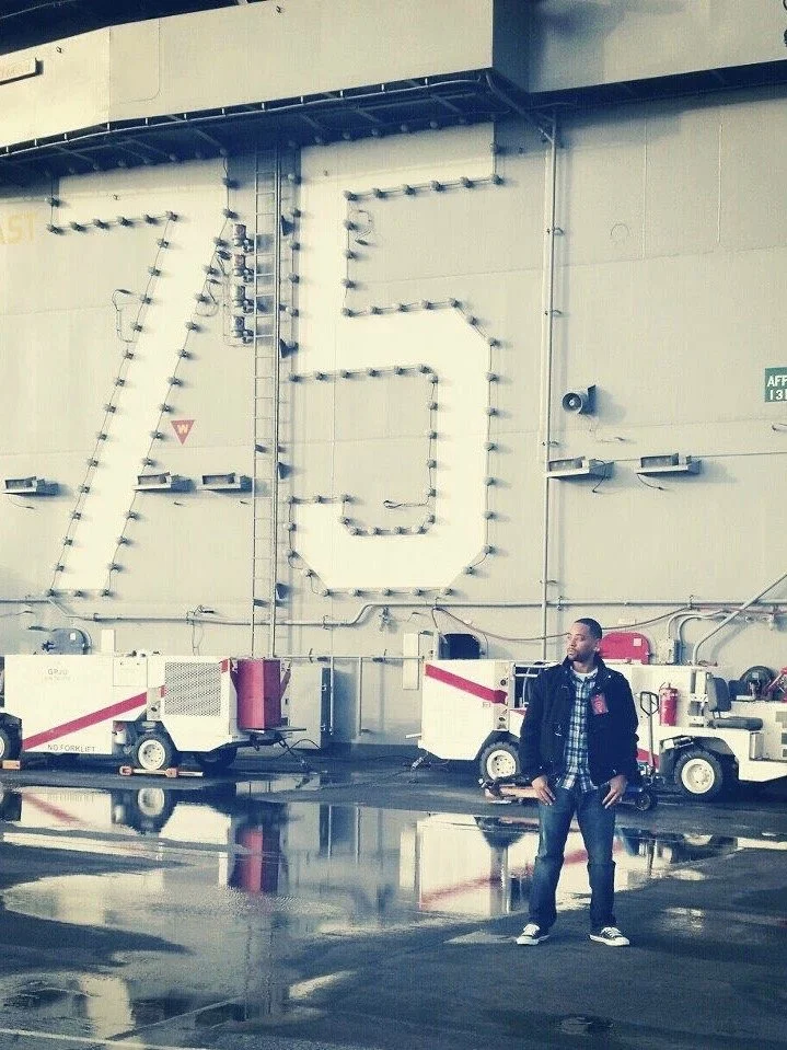 A photograph outside a hangar