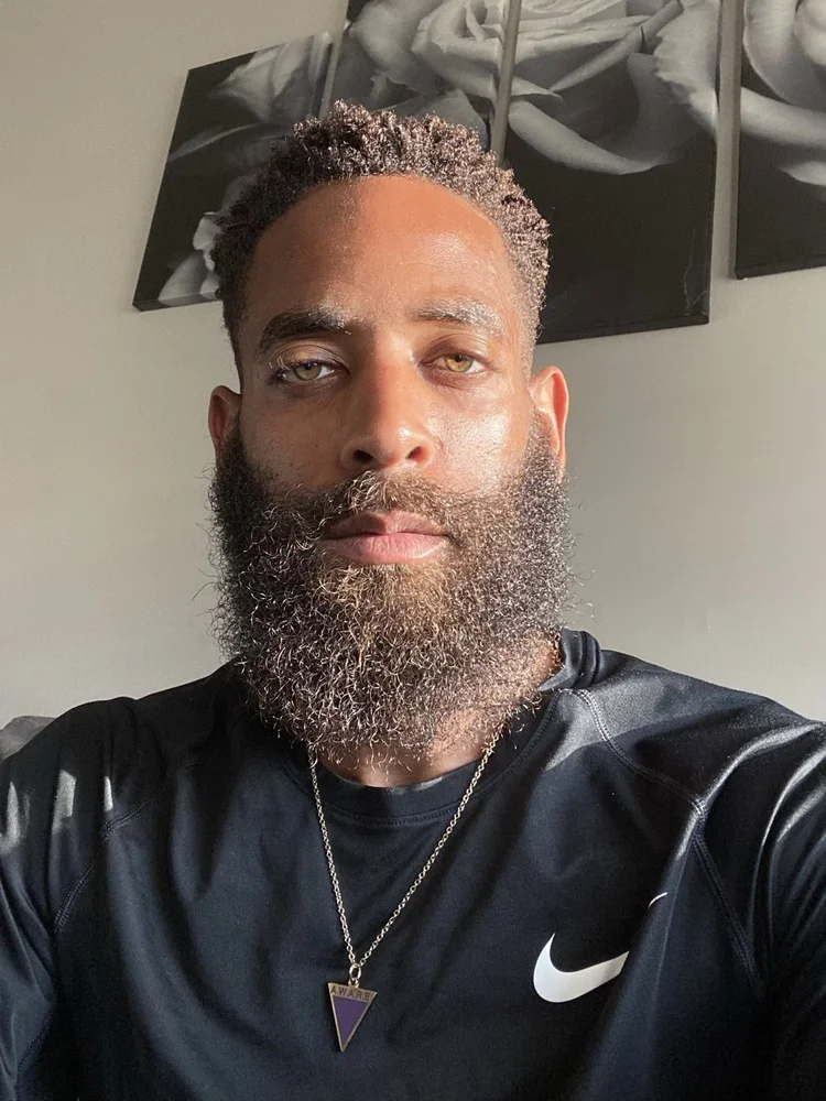 A portrait in a black Nike shirt