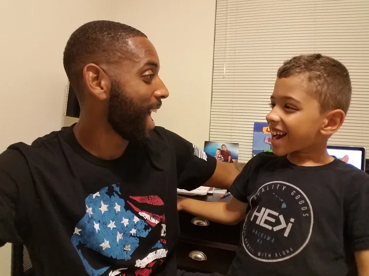 A father and son laughing together