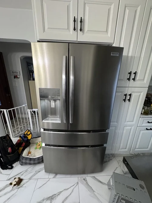 Refrigerator repair in a Manhattan kitchen