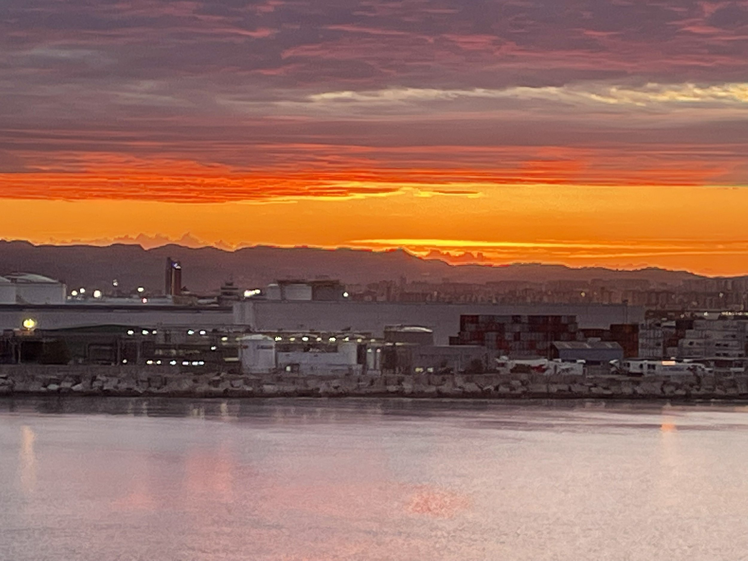 The harbor going red-orange at sunset.