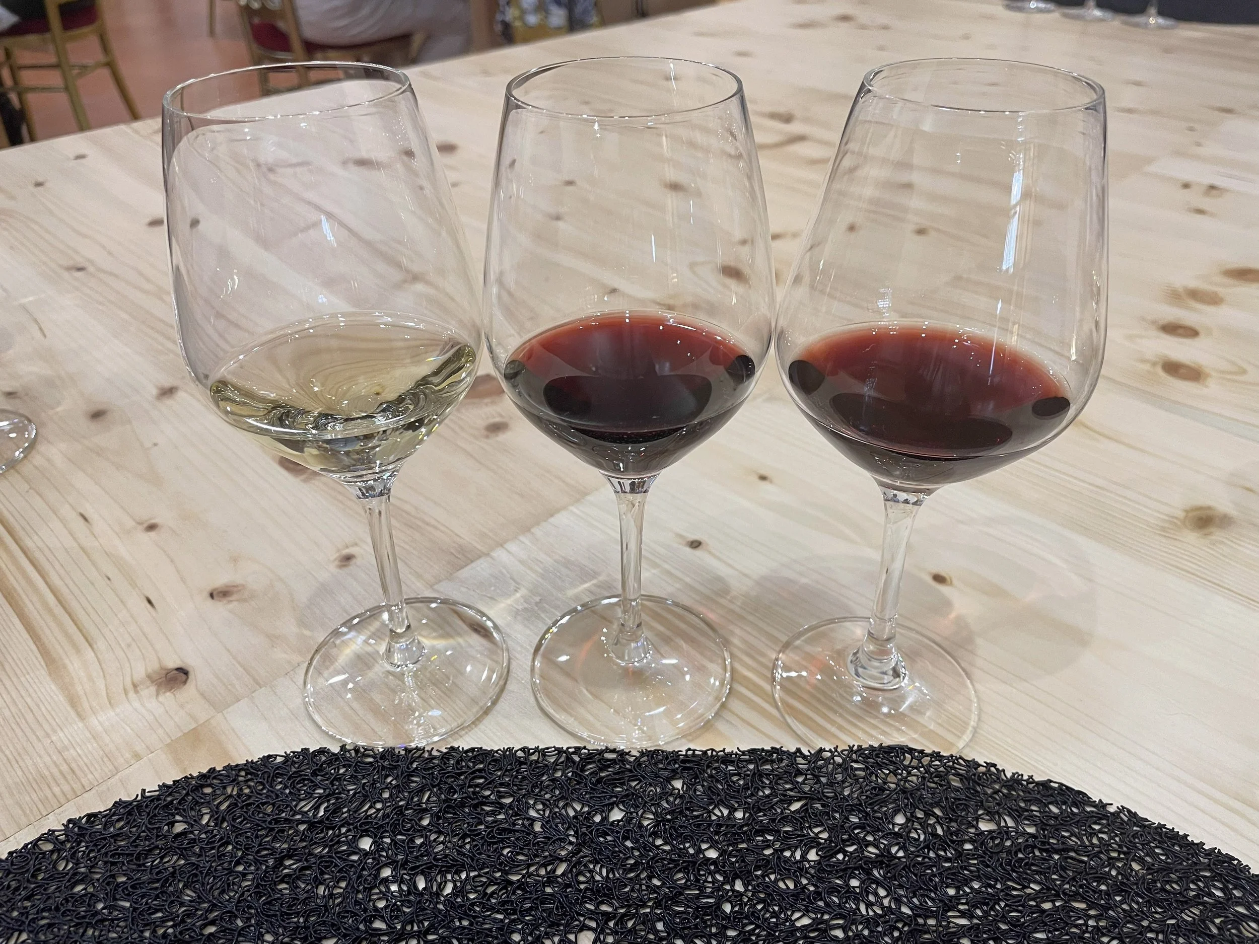 A tasting flight — one white, two reds — at the winery.