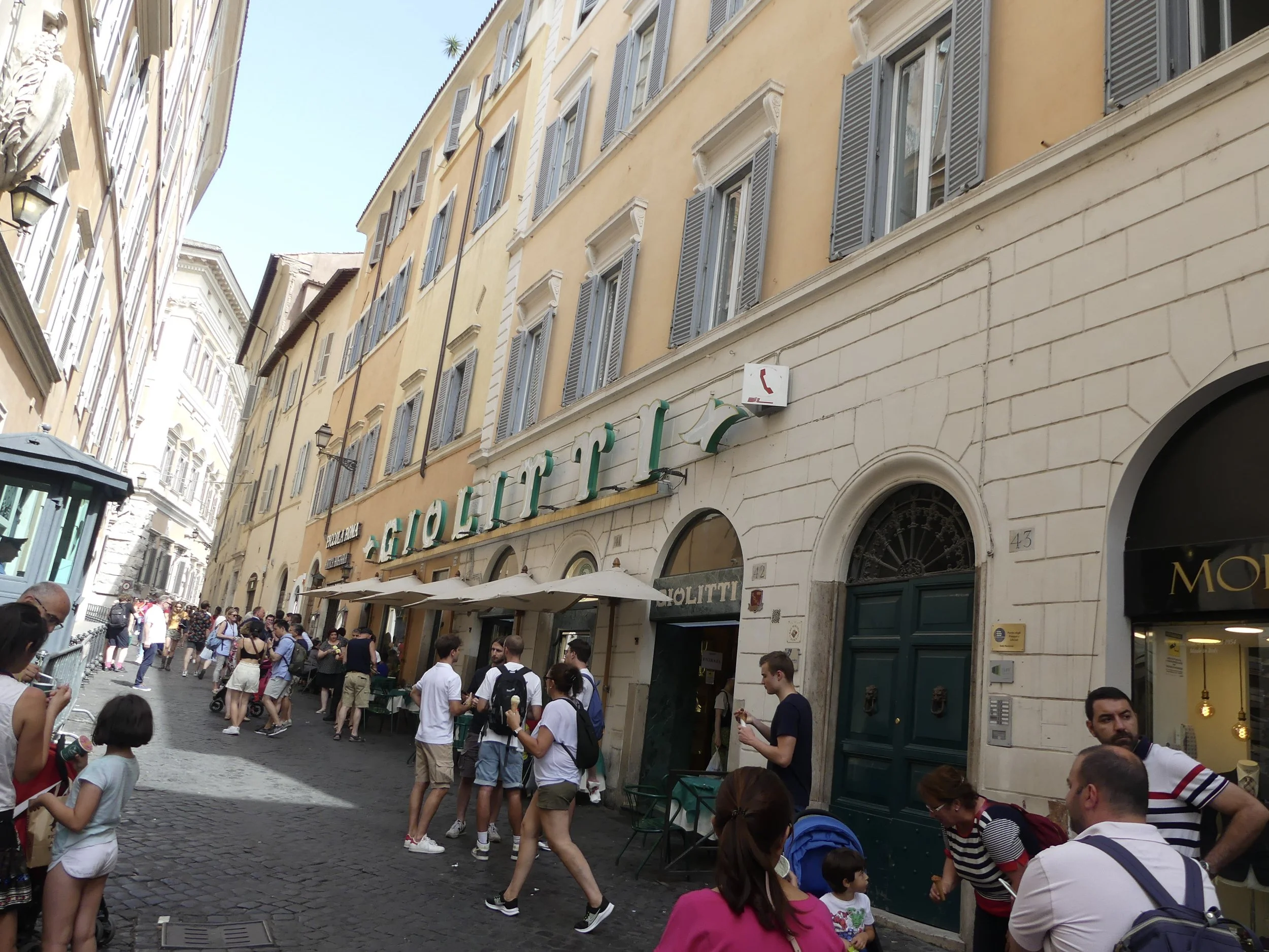 A busy Roman shopping street.