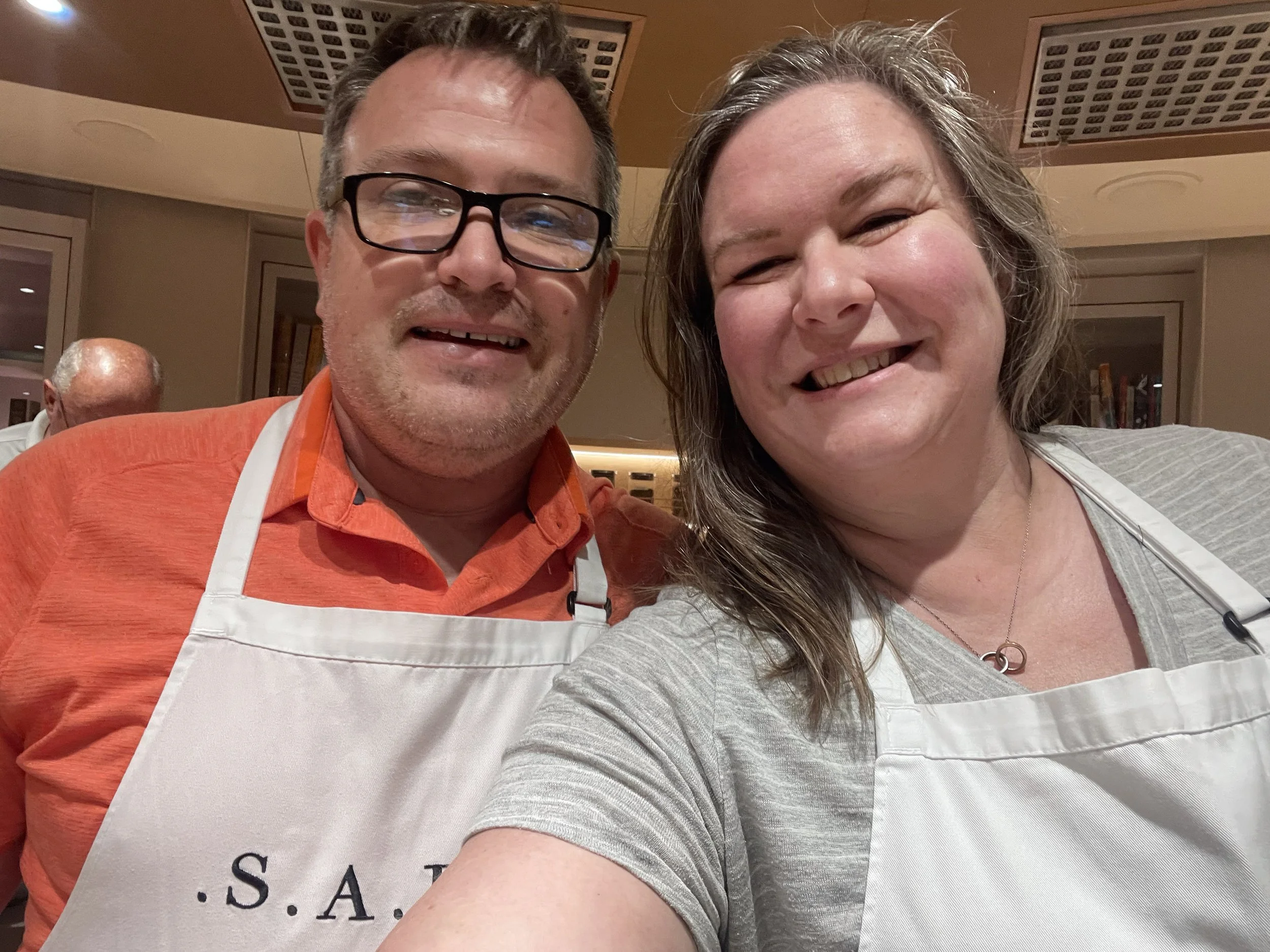 S.A.L.T. cooking class, aprons on.