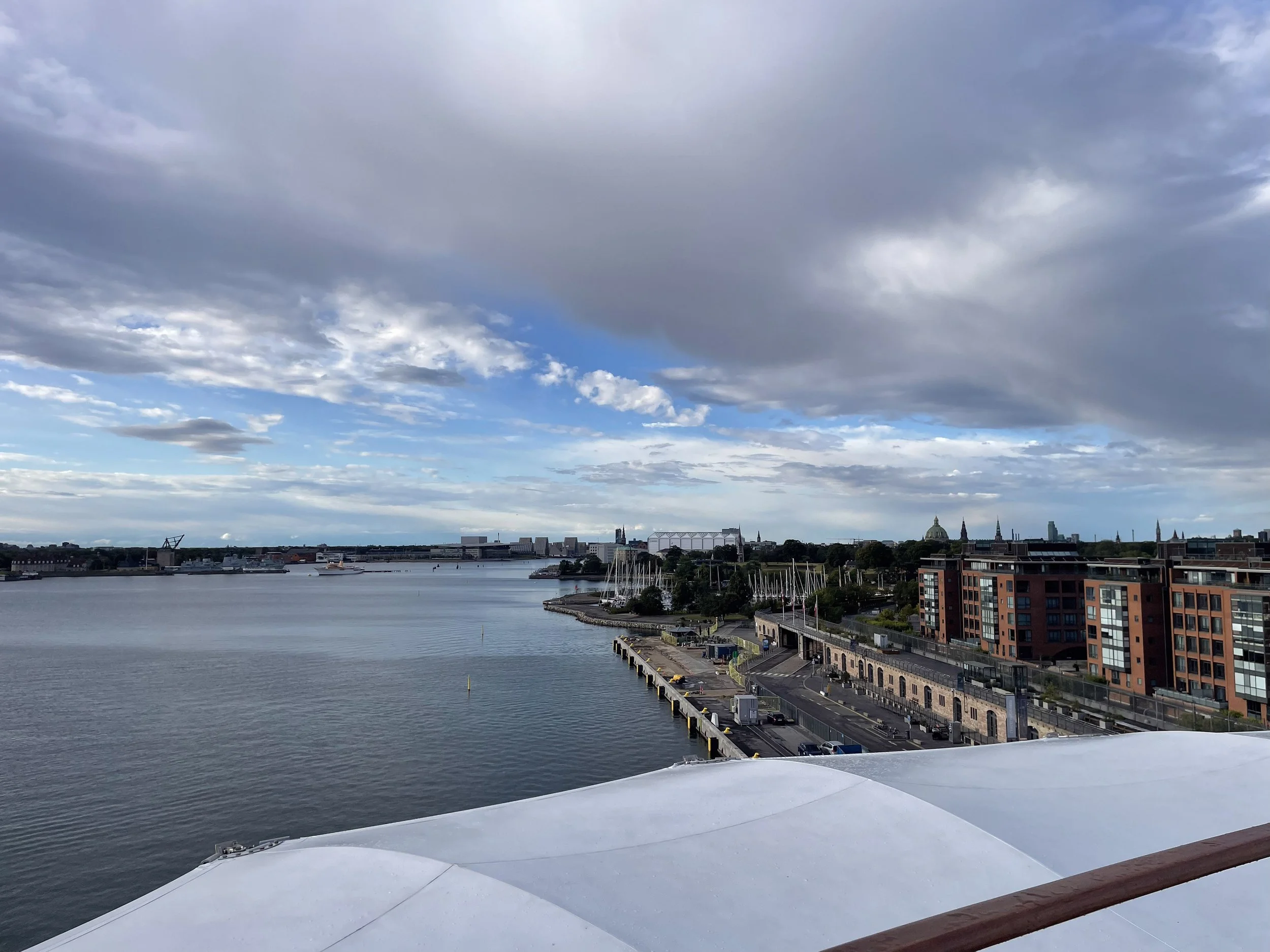 Arriving in Copenhagen by ship — the waterfront and spires from the deck.