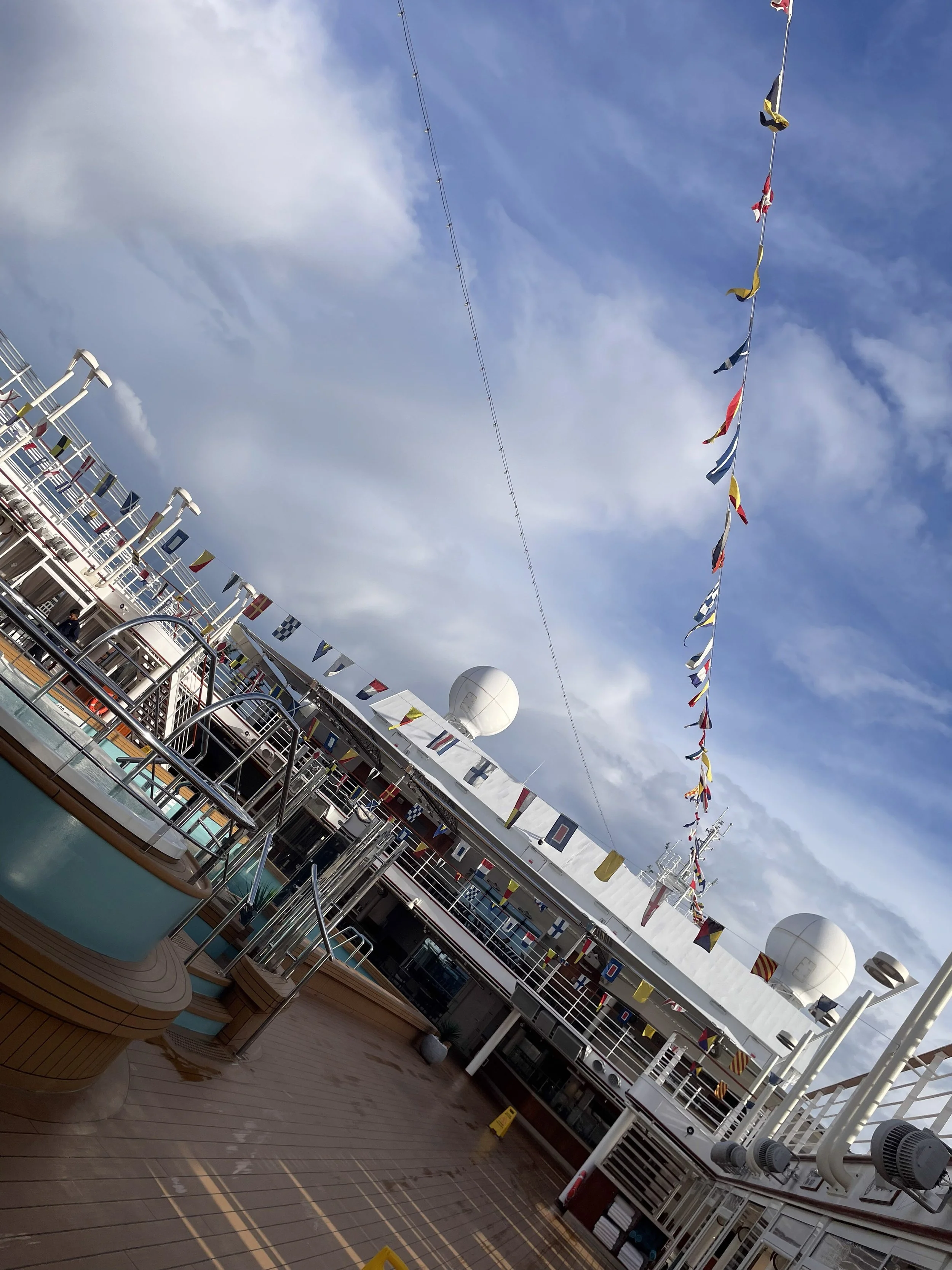 Pennant flags flying on deck at arrival.