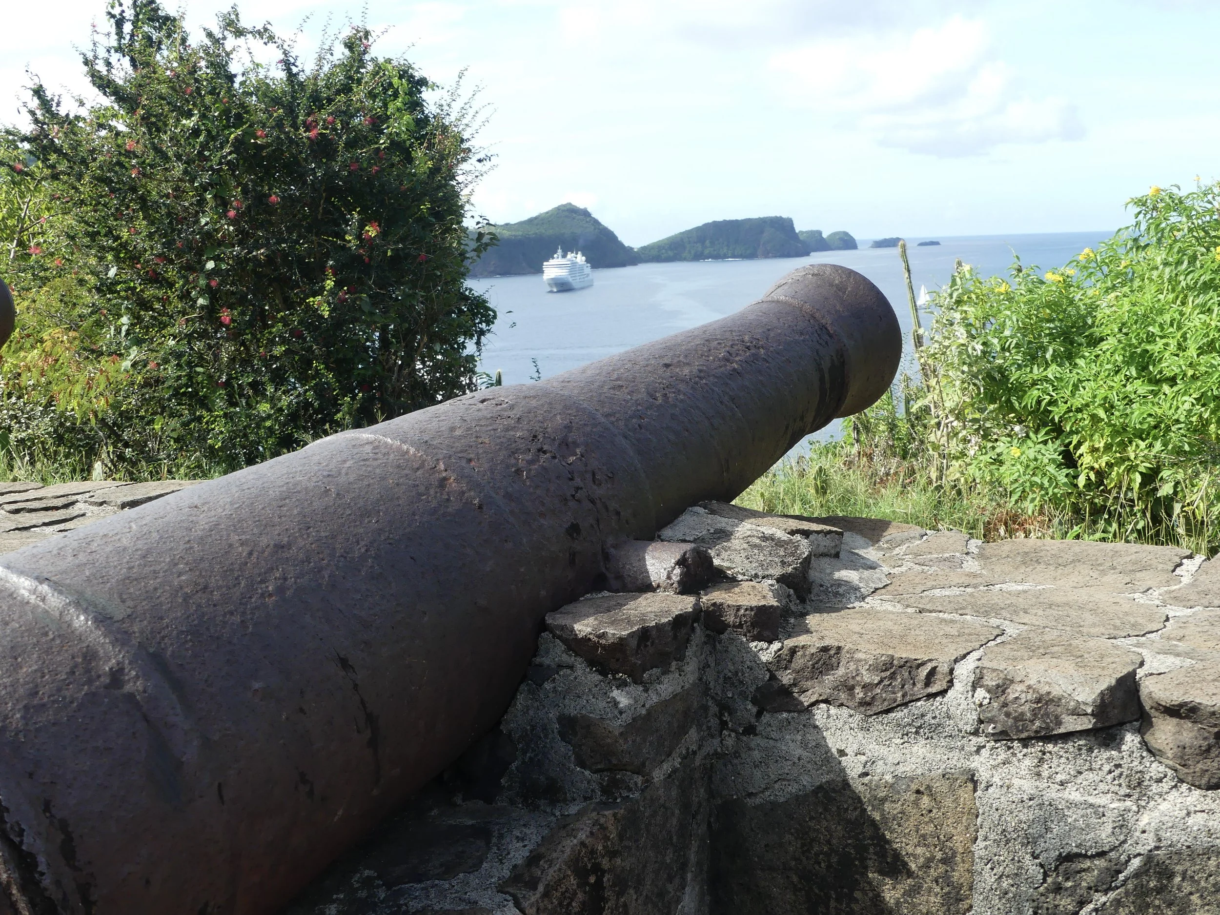 The cannon at Fort Hamilton, Bequia — Silver Moon in the bay beyond.