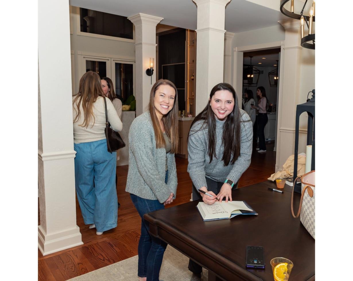 Members at the signing table