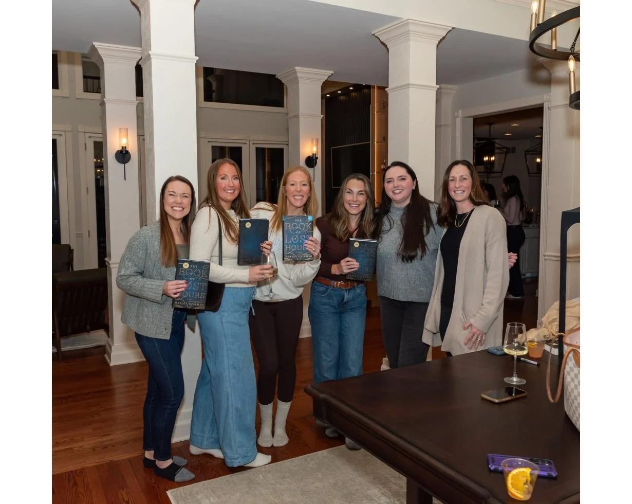 Members with their copies of the book