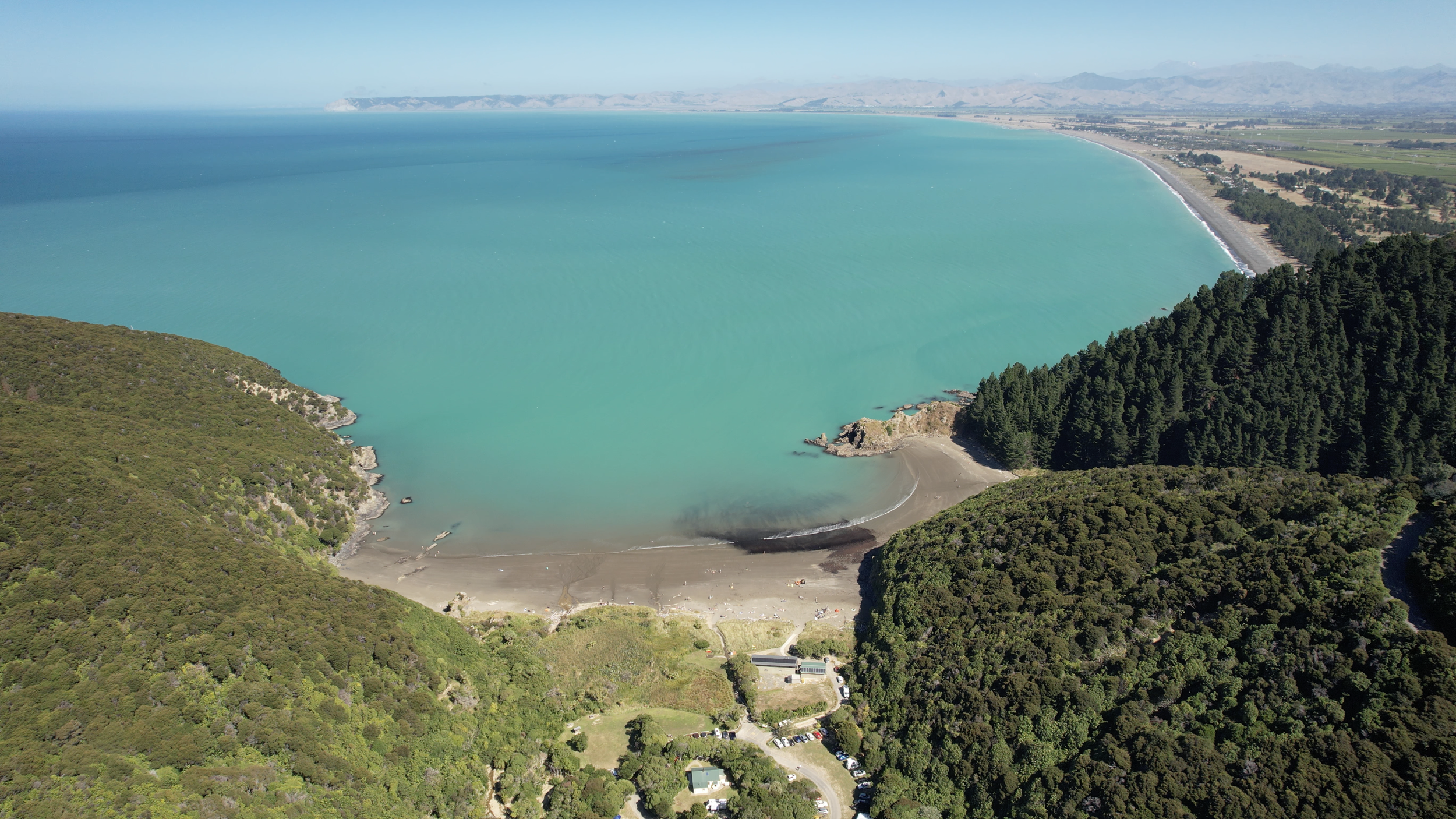 Aerial view over Pukatea Whites Bay and the Marlborough coastline