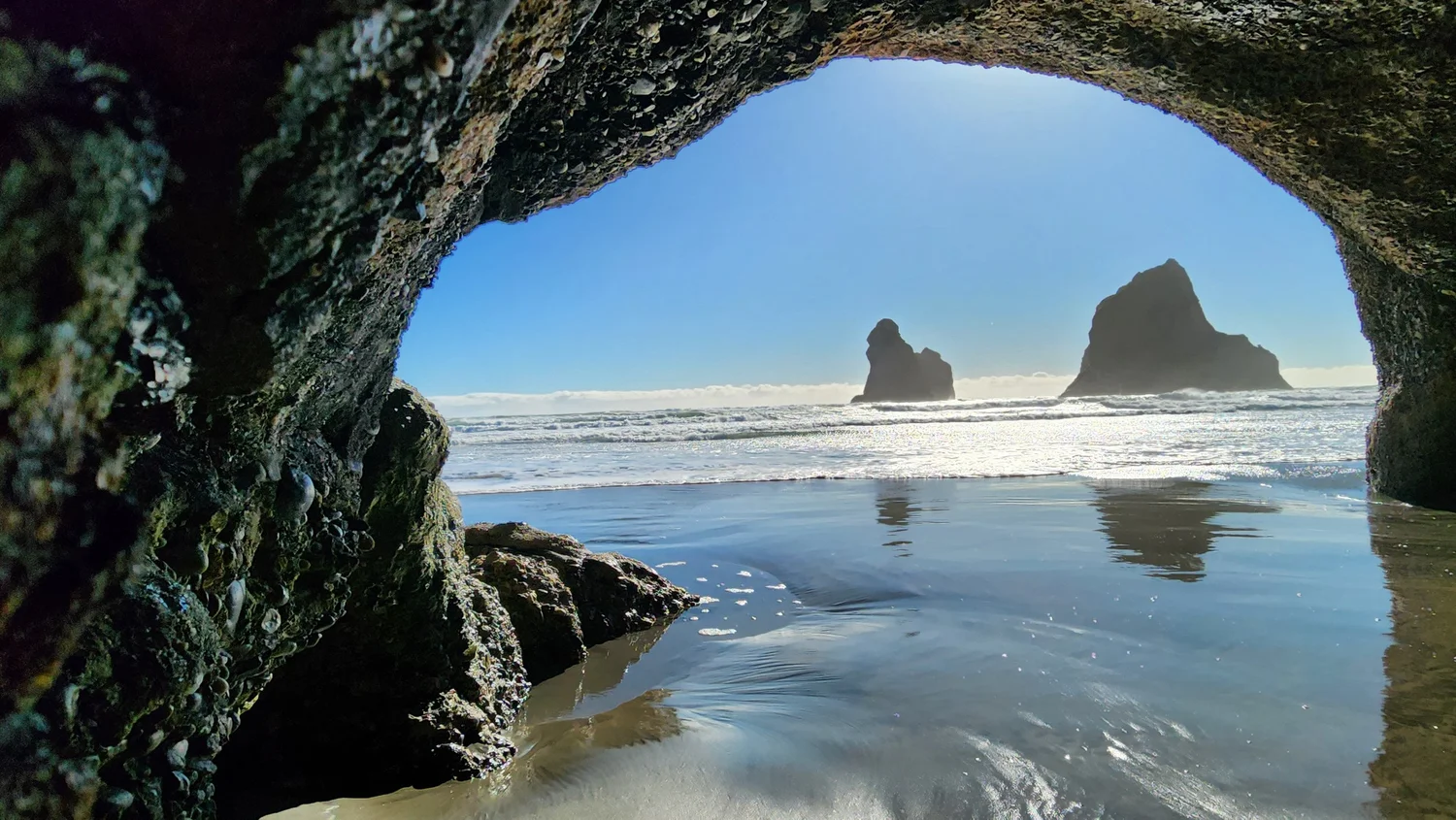 Our family exploring Wharariki Beach