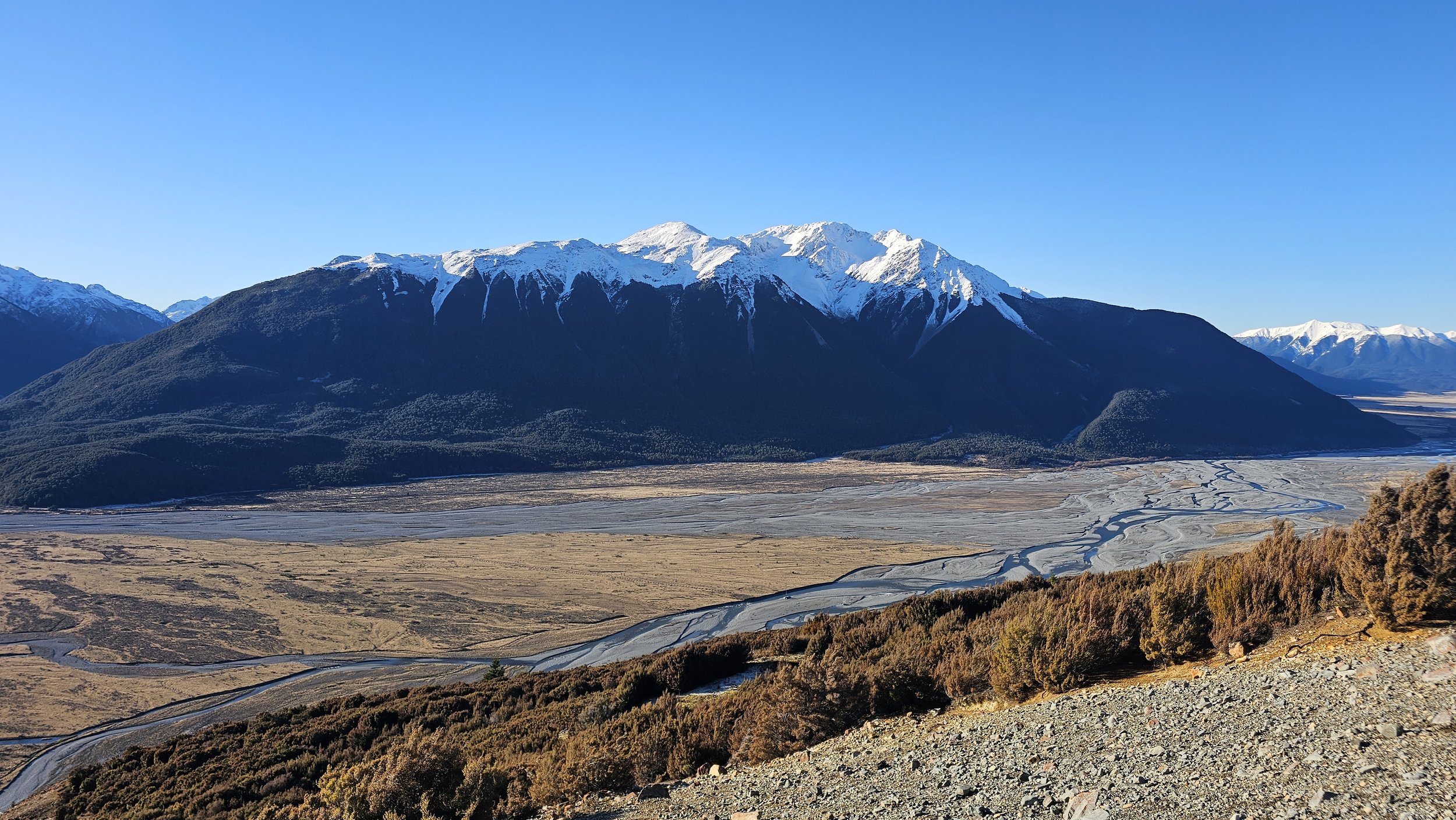 Huge braided river valley and snow-covered mountains from Bealey Spur