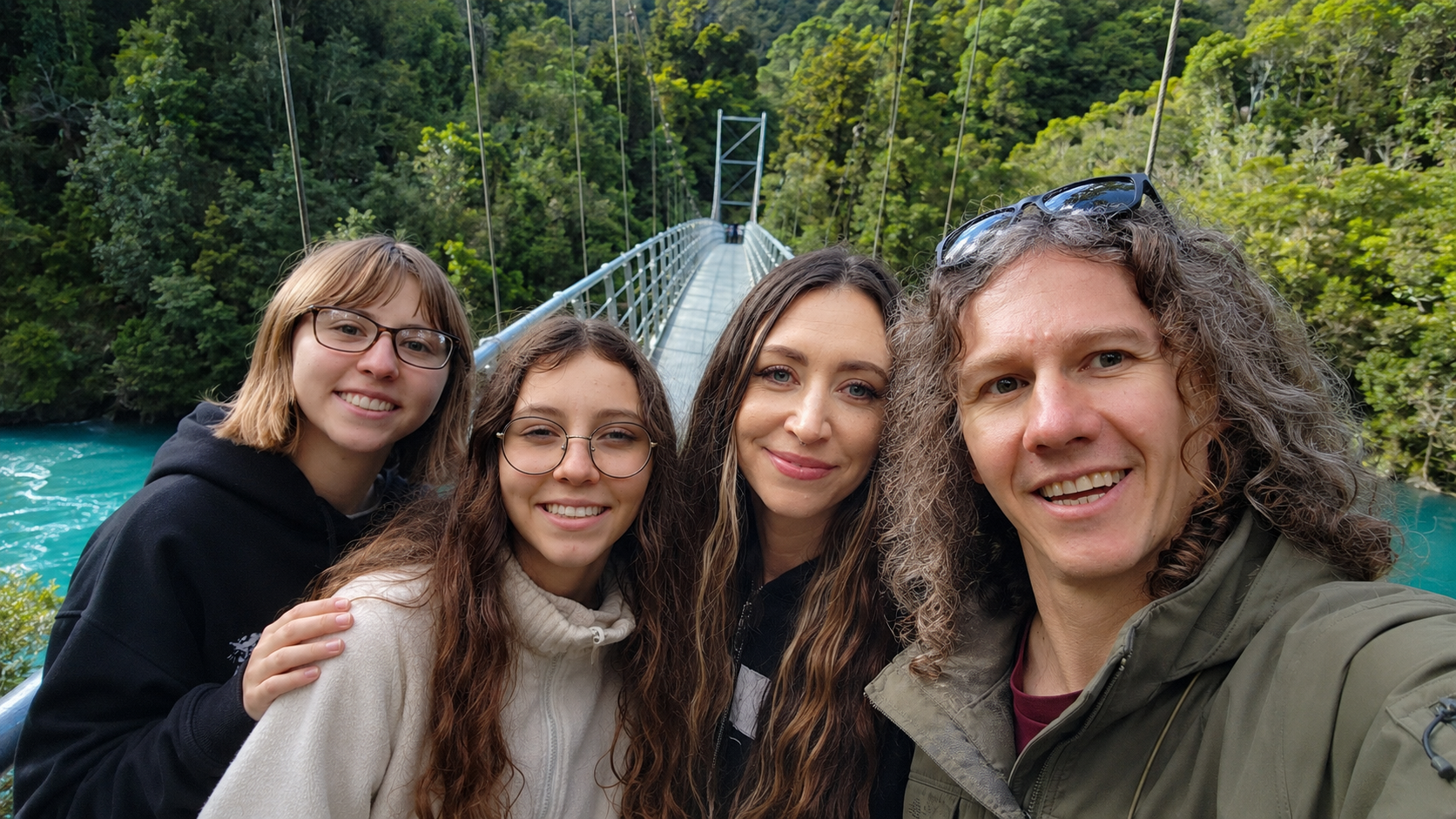 The Scenic Route family together beside a suspension bridge in New Zealand