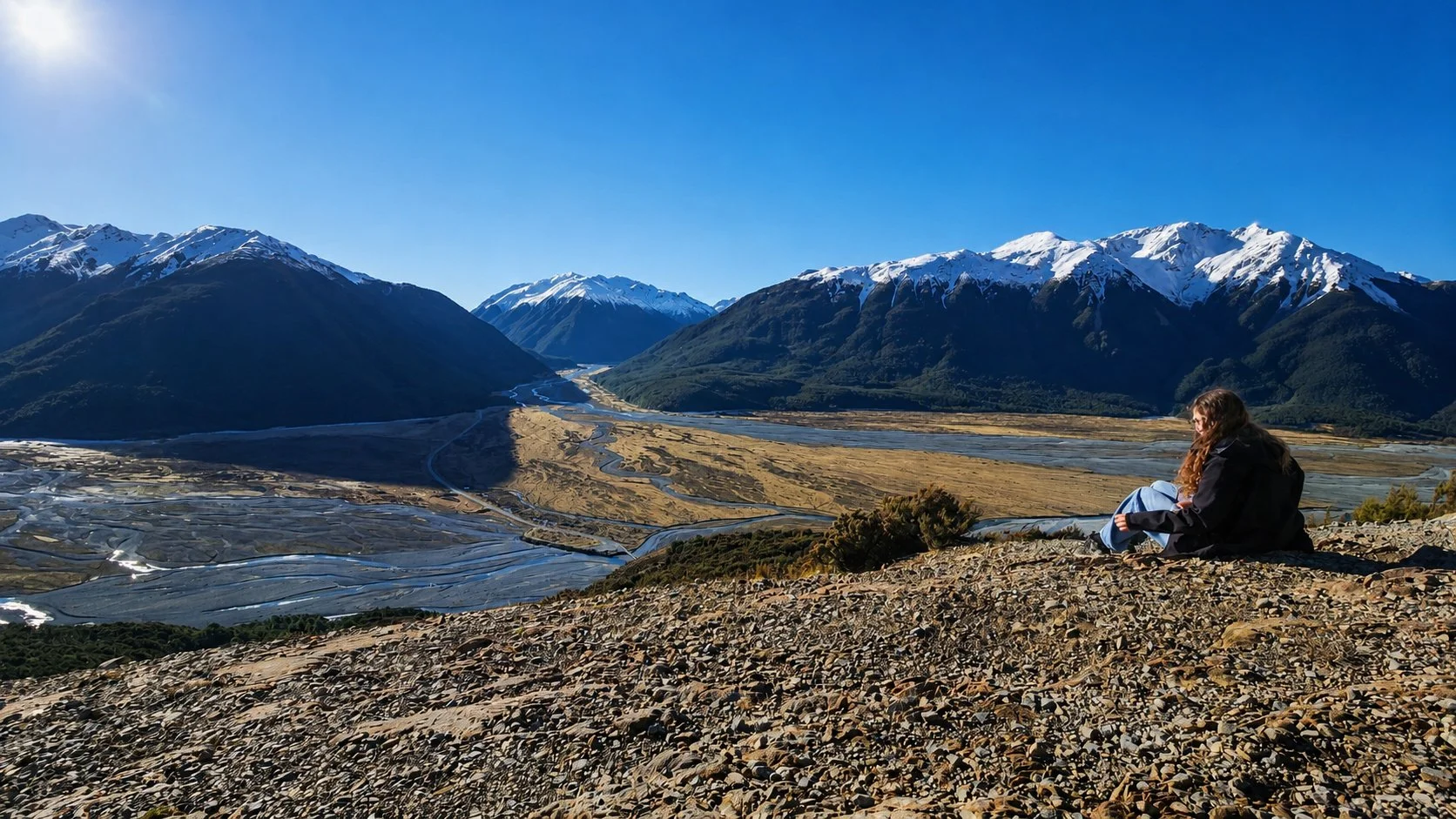 Taking a break overlooking the alpine valleys from Bealey Spur