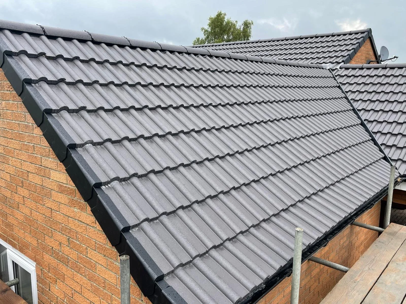 Dry verge and dry ridge fitted to a tiled roof by Gosforth Roofing