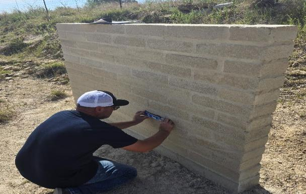 Wade measuring the wall before the first round