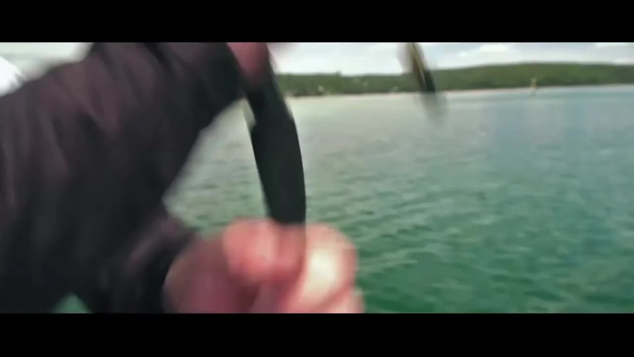 Sedona reel and green fishing line in use on the water.