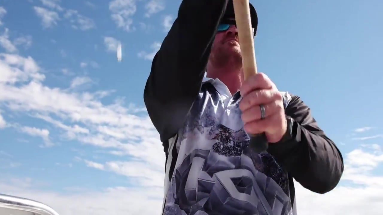 An angler fishing near coastal cliffs in my Shimano film.