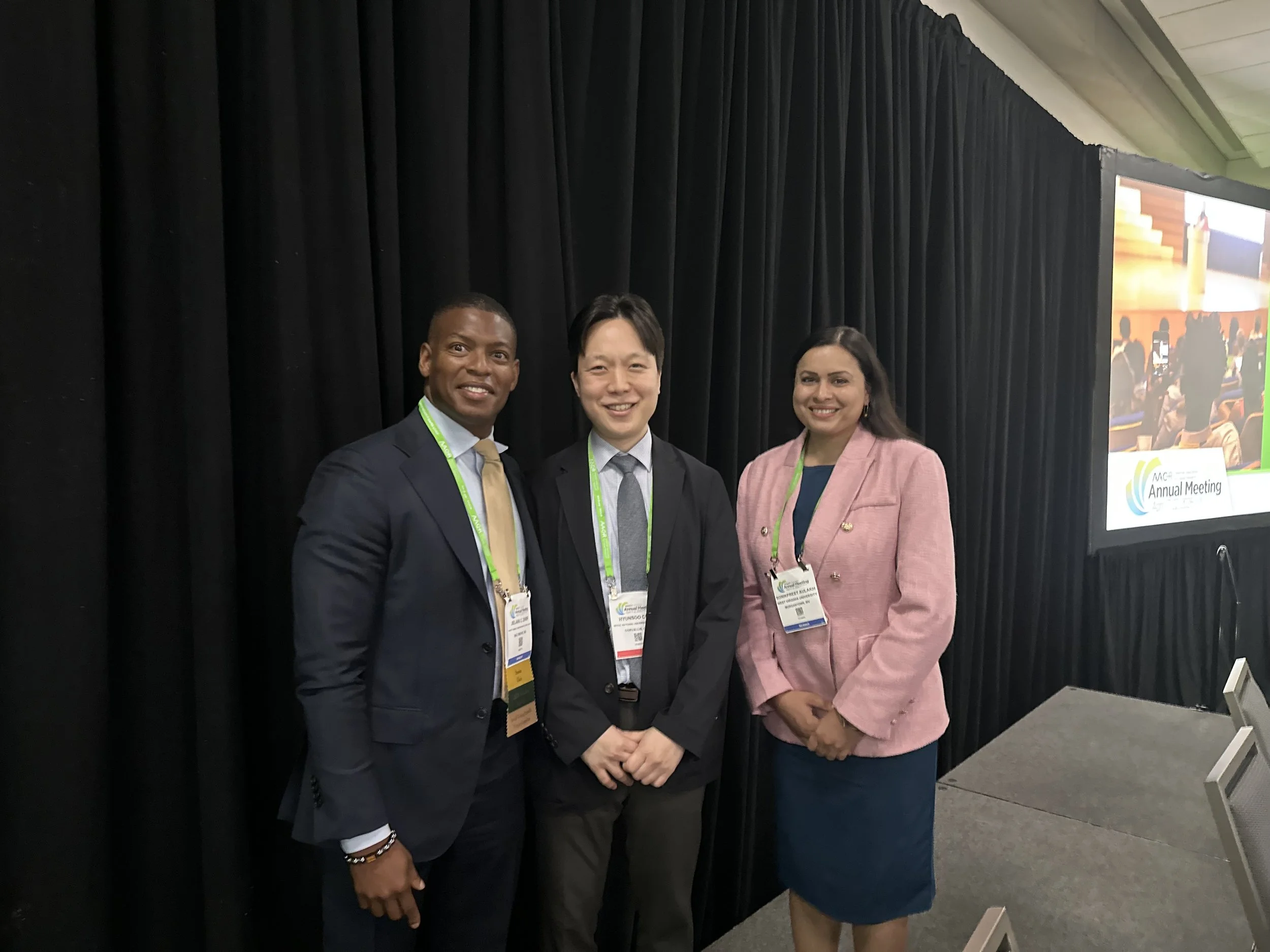 Apr 19, 2026 — With the session chairs after an oral presentation at AACR 2026.