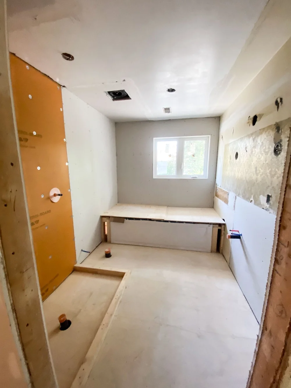Bathroom drywall and shower board installation before final finishes