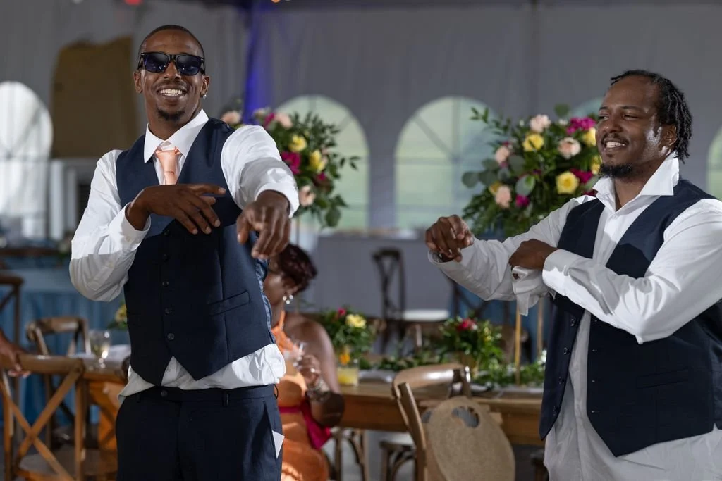 Groomsmen celebrating together during the reception
