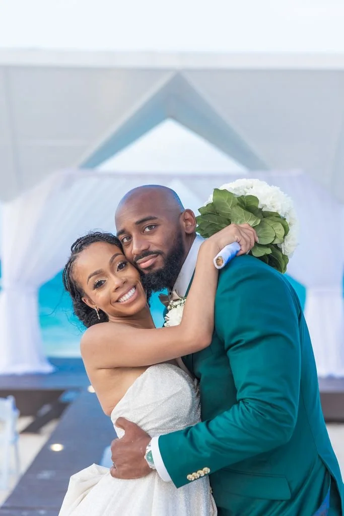 A destination wedding couple embracing
