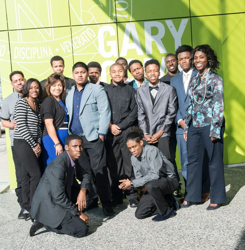 Educators and students dressed up together at a showcase