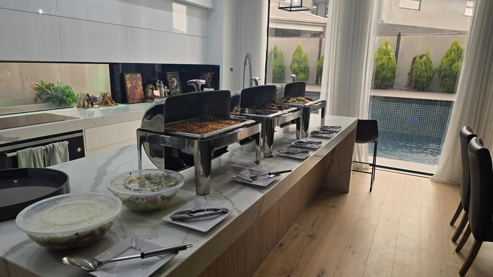 Hot buffet in chafing dishes for a private event at home