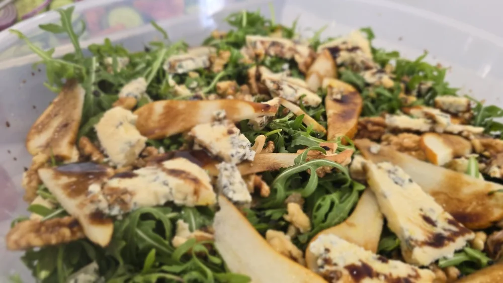 Rocket salad with charred pear, blue cheese and walnuts