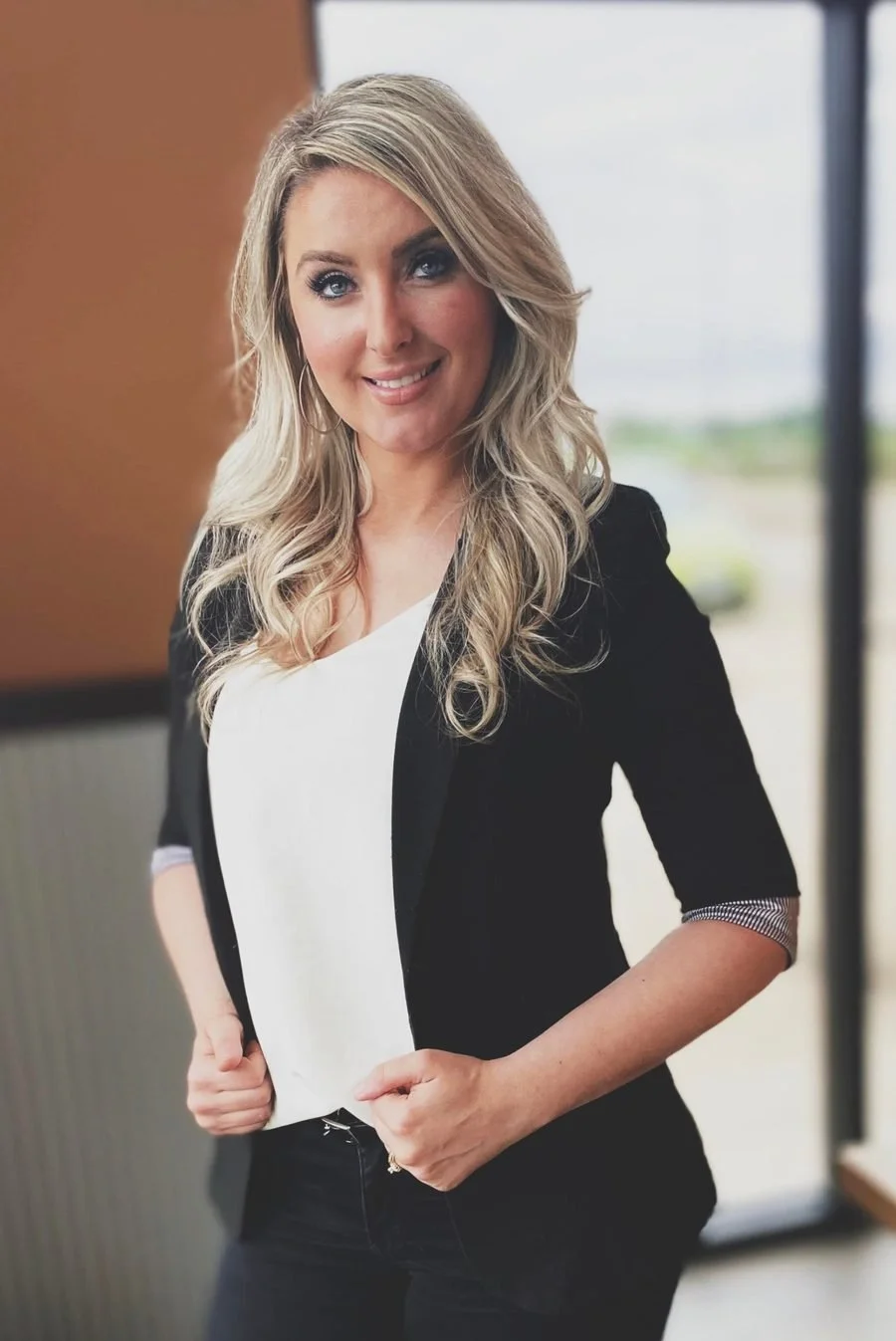 Dawn Towne smiling, in a black blazer